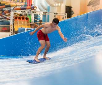 guy shredding waves on the FlowRider