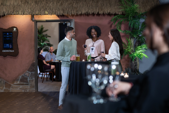 people standing around table in cocktail area