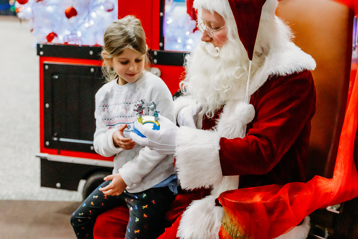 Girl sitting on santas lap