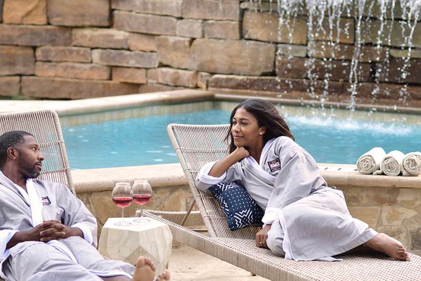 Couple enjoying the outdoor day spa lounge area at Spa Kalahari Couple enjoying the outdoor day spa lounge area at Spa Kalahari