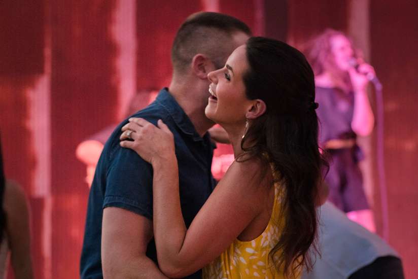 A husband and wife dancing together.