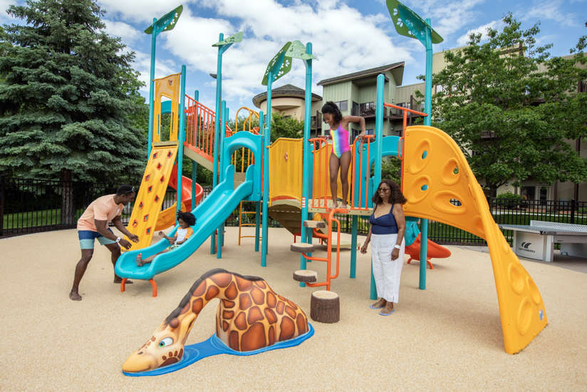family playing on the playground