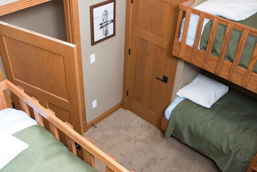 an overview of the Cottage's bedroom with bunkbeds