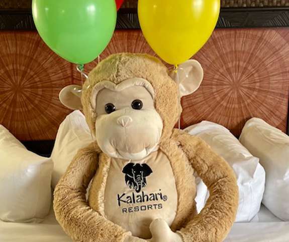 Monkey Stuffed Animal with Balloons Attached