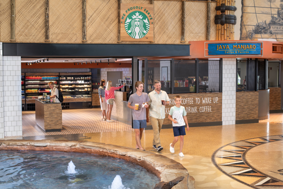 family walking out of the cafe with treats