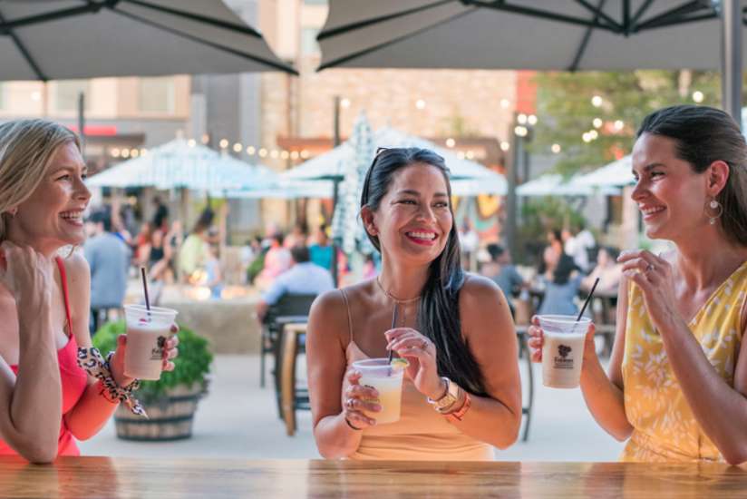 3 Girl Friends Enjoying the Bar at the Outdoor Amatuli Bar.