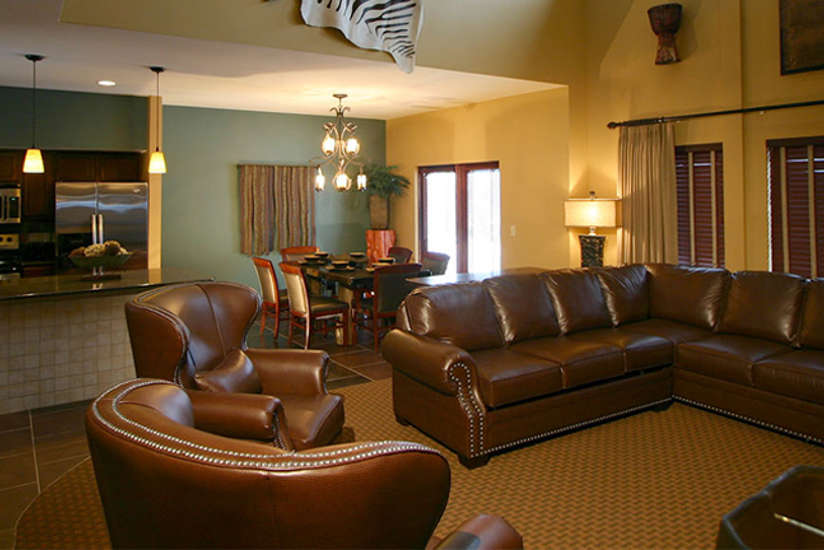 Nyumba Villa interior showing living room, dining room, and kitchen.