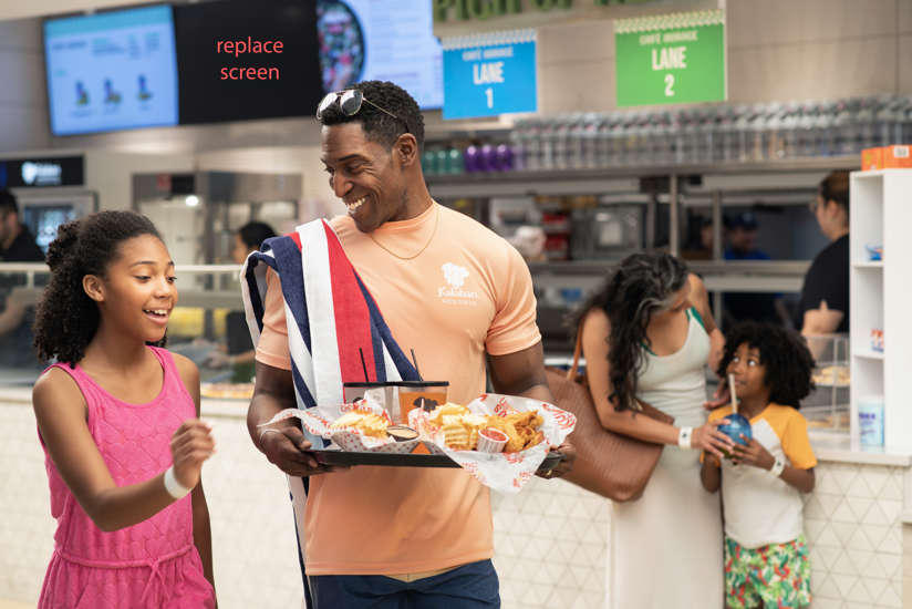 family walking with food from kukus chicken