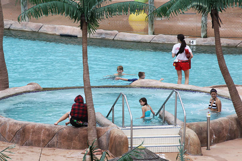 Guests relaxing in Lagoon Pool.