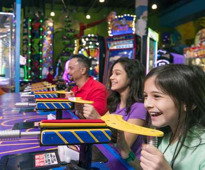 Family playing in the arcade