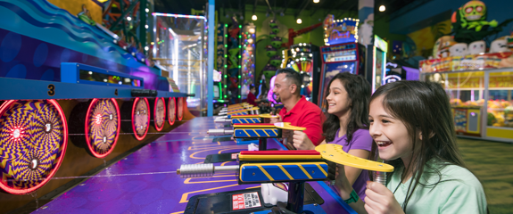 Family playing in the arcade