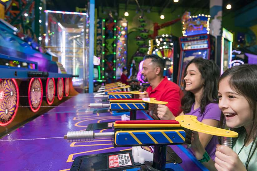 Family playing in the arcade